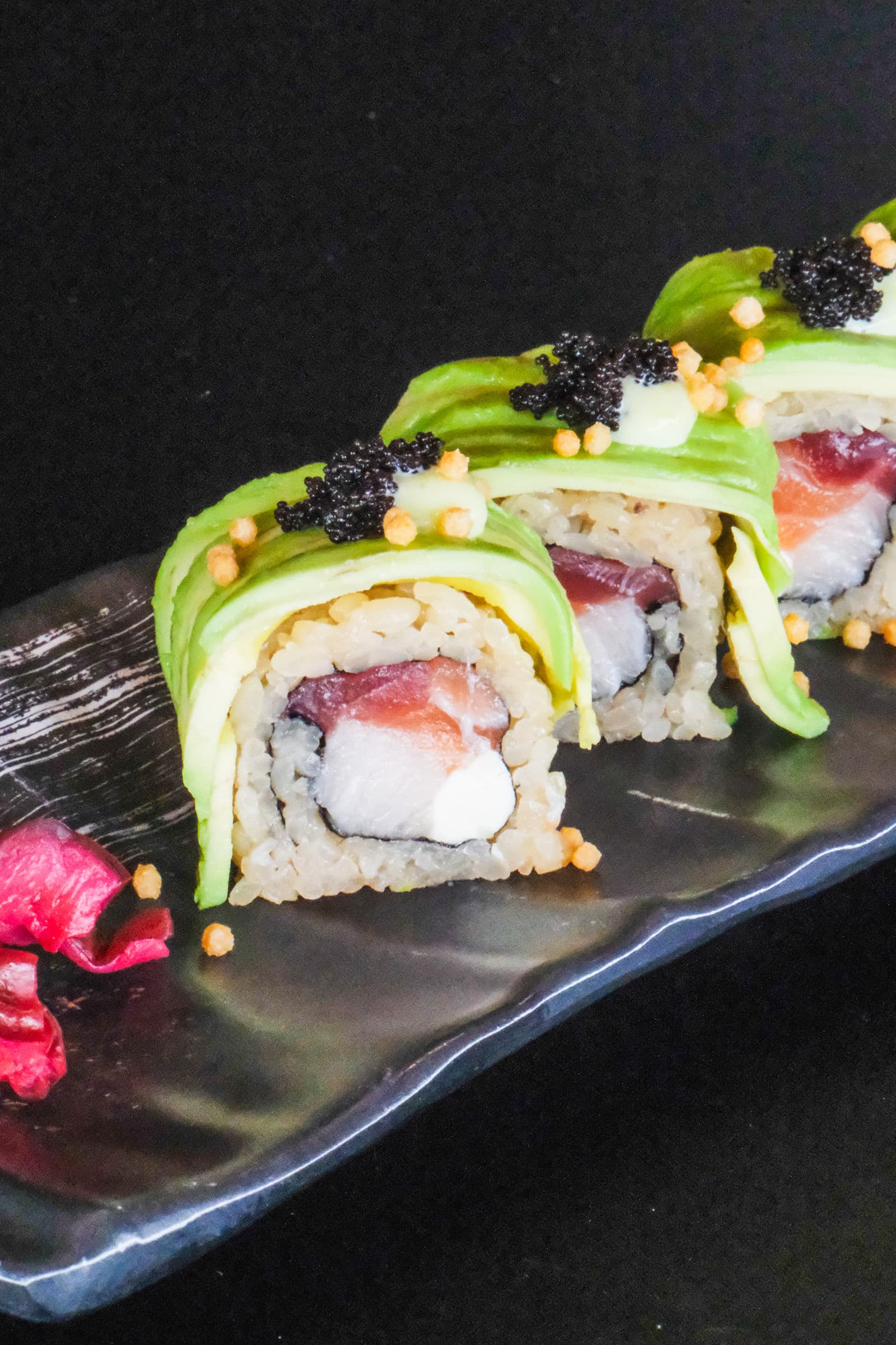 Avocado-wrapped dragon roll with tobiko