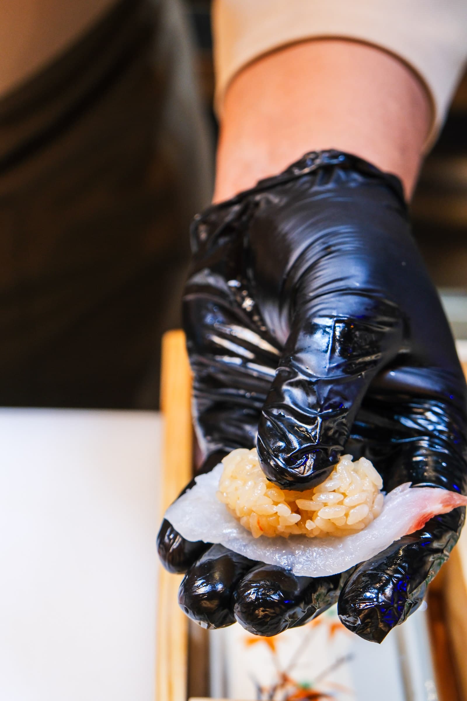 Chef handcrafting nigiri sushi
